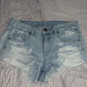 Warn in, vintage, high-waisted denim shorts.